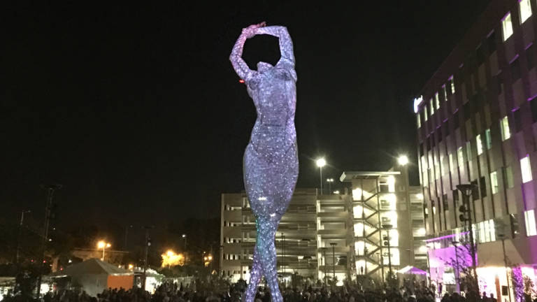 Giant statue of naked woman being installed on California 